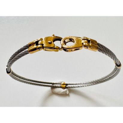 BRACELET cable in steel and yellow gold 750°/°°....