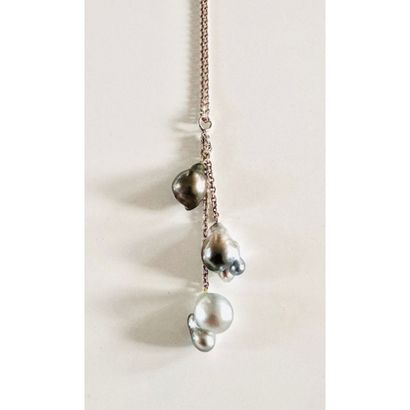 Silver necklace adorned with 3 light to medium...