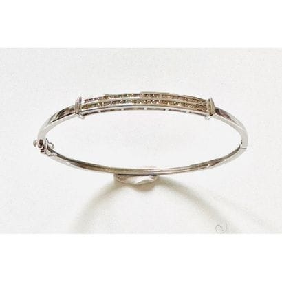 Rigid opening BRACELET in 750°/°° white gold...