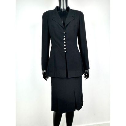 CHANEL. Black wool gabardine suit consisting...