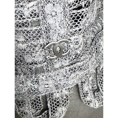 CHANEL. Evening jacket in black cotton lace...