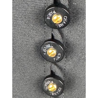 CHANEL. Black wool gabardine suit consisting...
