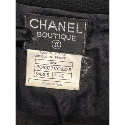 CHANEL. Black wool gabardine suit consisting...