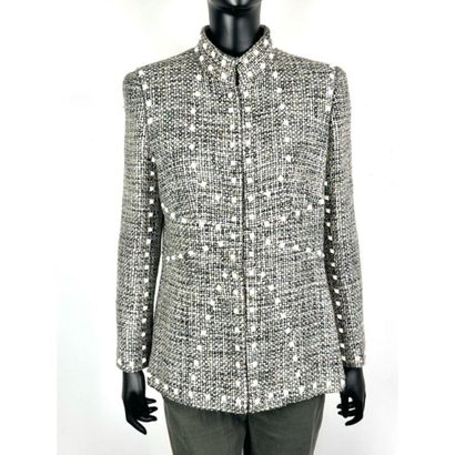 CHANEL. Tweed jacket in shades of gray, pink,...