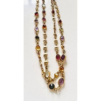 COLLIER en or jaune 750°/°° serti clos de...