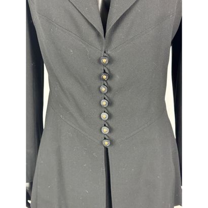 CHANEL. Black wool gabardine suit consisting...
