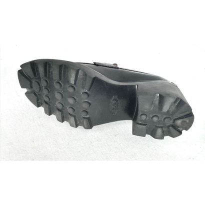 TOD'S. Black leather loafers adorned with...