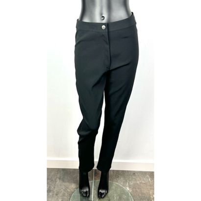 CHANEL. Black stretch acetate pants. Signed...