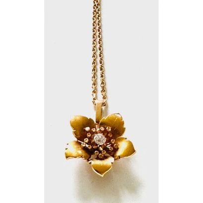 Yellow gold 750°/°° flower pendant set with...