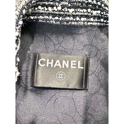 CHANEL. Black, pearl-grey and gold tweed...