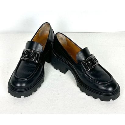 TOD'S. Black leather loafers adorned with...