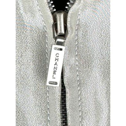 CHANEL. Evening jacket in silver silk satin...