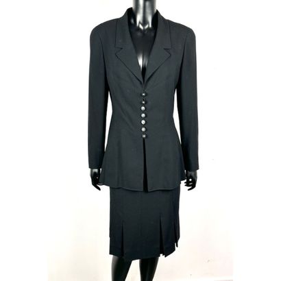 CHANEL. Black wool gabardine suit consisting...