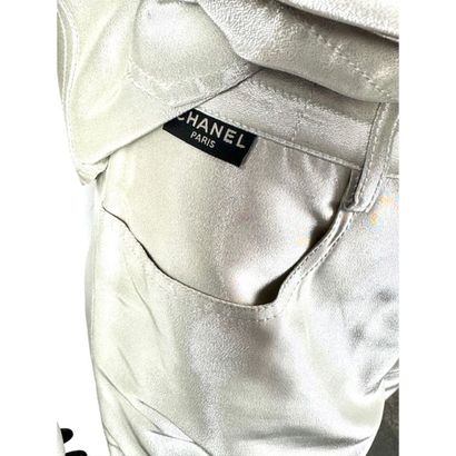 CHANEL. Denim pants in silver silk satin...