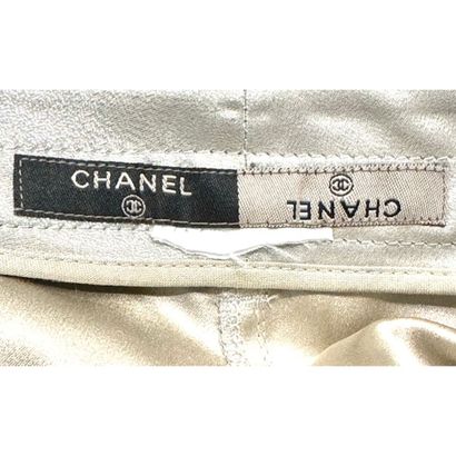 CHANEL. Denim pants in silver silk satin...