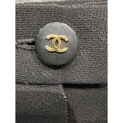 CHANEL. Black wool gabardine suit consisting...