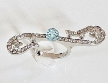 RING in white gold 750°/°° set with a faceted...