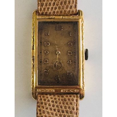 ART DECO. Rectangular watch in yellow gold...
