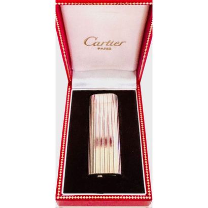 CARTIER. Grooved silver lighter. Signed and...