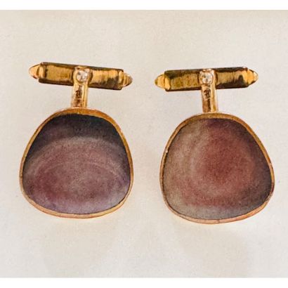 PAIR OF GOLDEN METAL HANDLEBUTTONS. With...