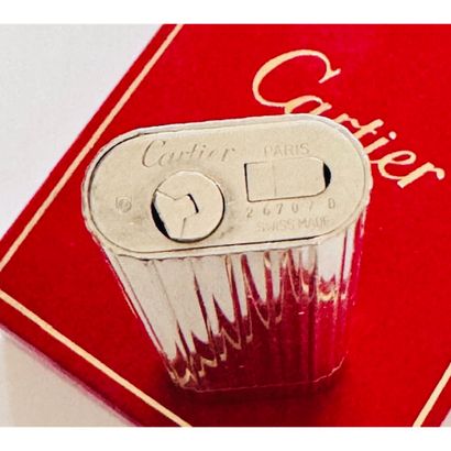 CARTIER. Grooved silver lighter. Signed and...