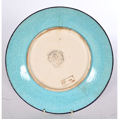 LONGWY. Enameled ceramic FLAT with central...
