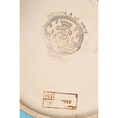 LONGWY. Enameled ceramic FLAT with central...