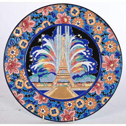 LONGWY. Enameled ceramic FLAT with central...