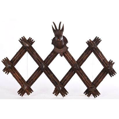BLACK FOREST COAT HOLDER decorated with a...
