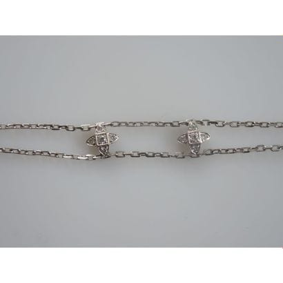 REPOSSI.
BRACELET en or blanc orné de 2 chaînes...