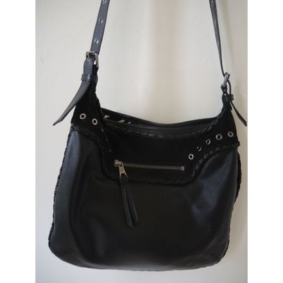 LONGCHAMP.
Pochette en cuir et daim noir....