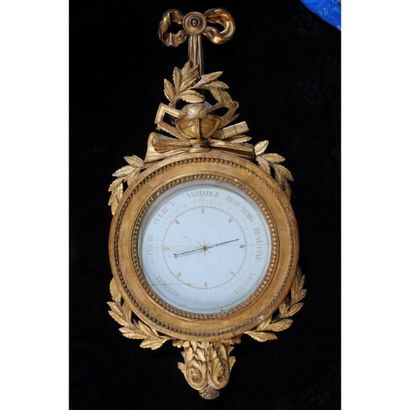 BAROMETRE LOUIS XVI en bois doré à décor...