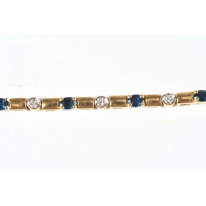 BRACELET ligne en or jaune 750°/°° orné de...