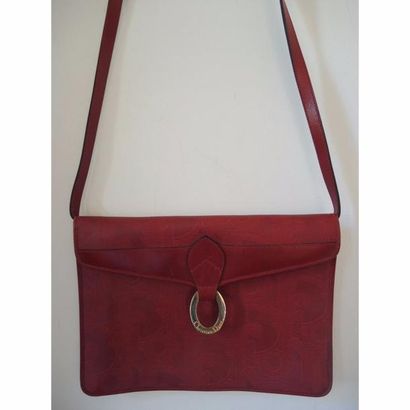DIOR. Pochette en toile monogrammée et cuir...