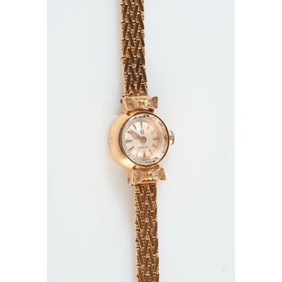 OMEGA. Montre de dame en or 750°/°° Ø.1,5cm....