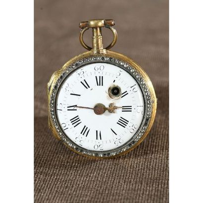 MONTRE en métal doré et bordure de petits...