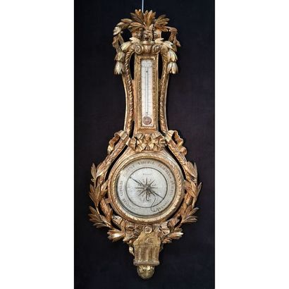BAROMETRE LOUIS XVI en bois doré et largement...