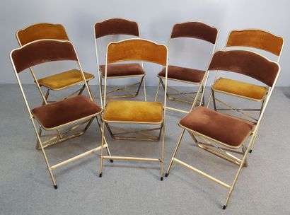 SEVEN folding chairs in gilded metal and...