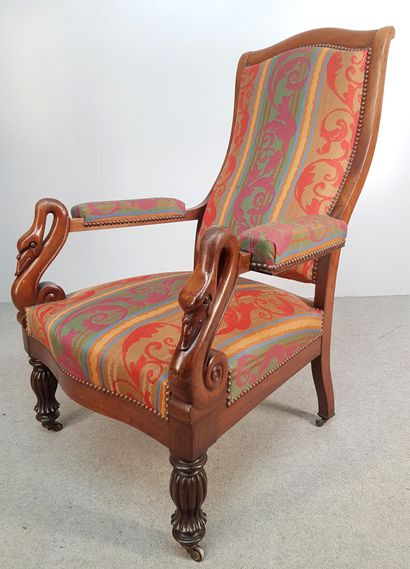 Walnut armchair upholstered in a fabric decorated...