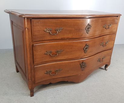 A walnut and walnut veneer COMMODE, curved...