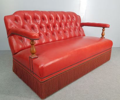 Red leather living room with fringed edges...