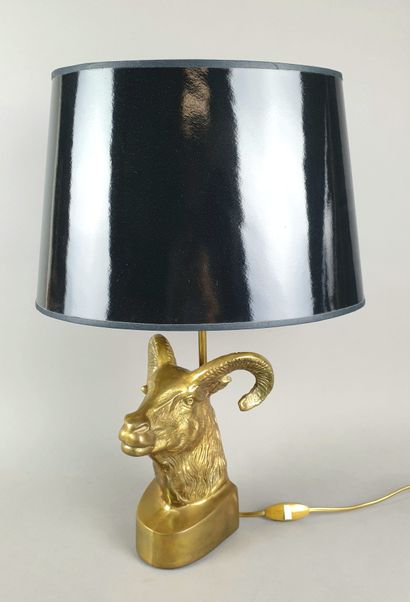 Table lamp with a gilded metal base representing...