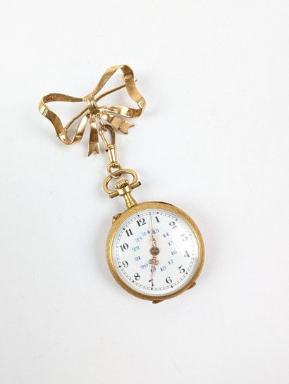 Montre de col en or jaune 750 ‰ surmontée...