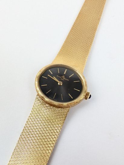 BAUME & MERCIER
Montre bracelet dame en or...