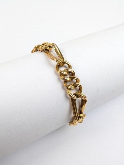 Bracelet en or jaune 750 ‰ maillons figaro...