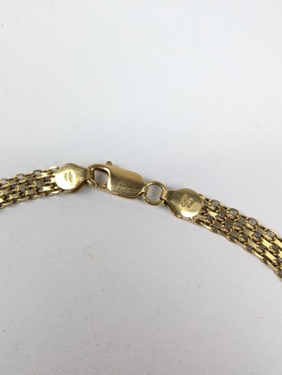 COLLIER en or jaune 750 ‰ orné d'un motif...