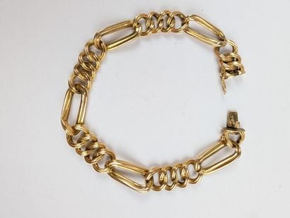 Bracelet en or jaune 750 ‰ maillons figaro...