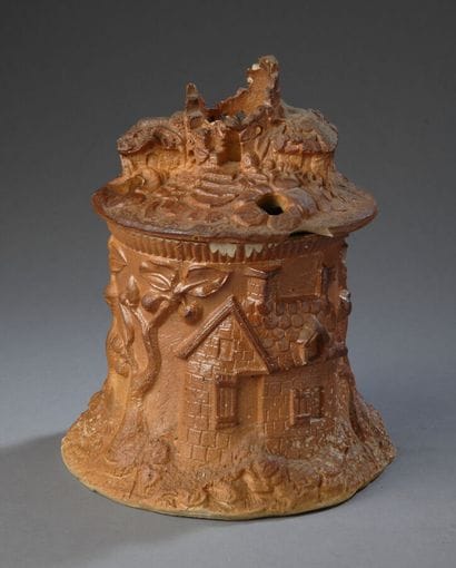 A slightly glazed, painted earthenware pot,...