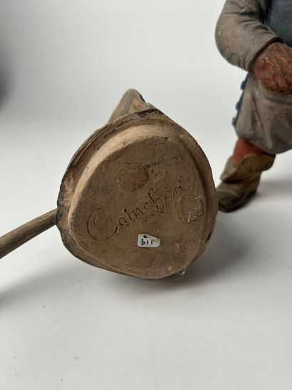 Polychrome terracotta figure of a swordsman....