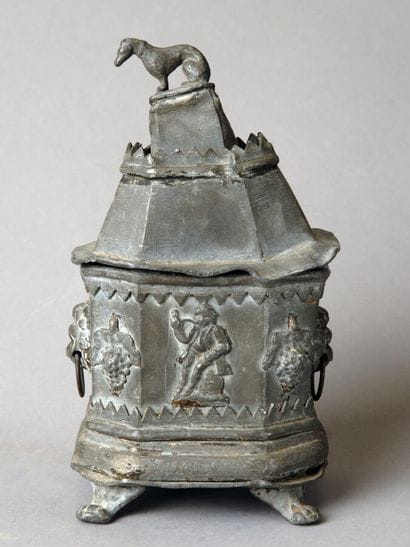 An octagonal pewter tobacco jar, also resting...